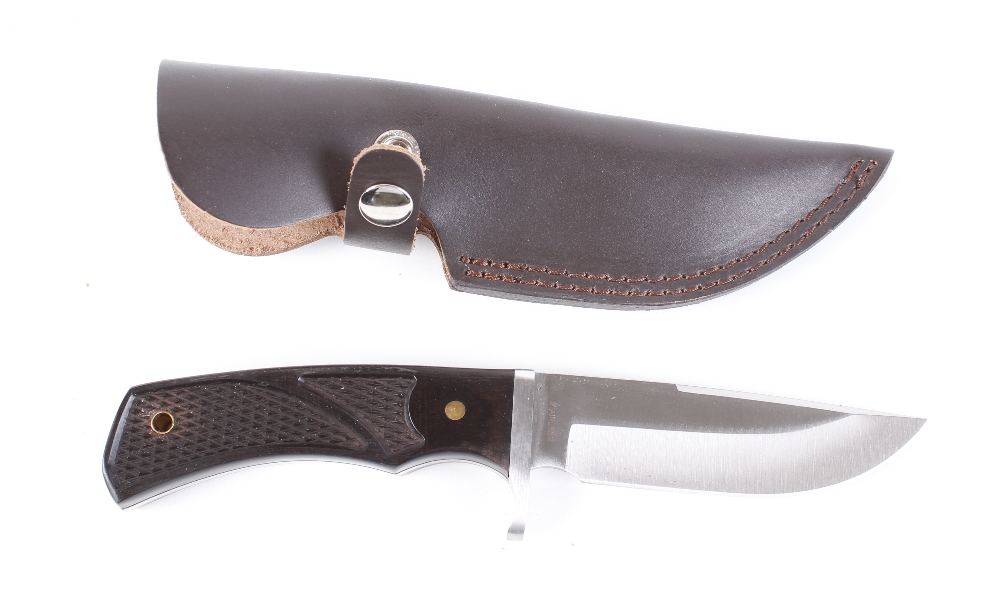 Clip point knife by Whitby, 4½ ins blade, composite grips, in leather sheath [Note: Under the - Image 2 of 2