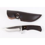 Clip point knife by Whitby, 4½ ins blade, composite grips, in leather sheath [Note: Under the