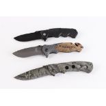 Browning X50 folding knife, 3½ ins blade; with two other folding knives (3) [Note: Under the