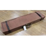 Brown canvas and leather gun case by Brady, green baize lined interior for 31 ins barrels