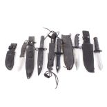 Four various diver type knives together with a Remington hook back blade