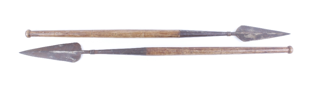 Two African spade pointed spears with short wooden shafts