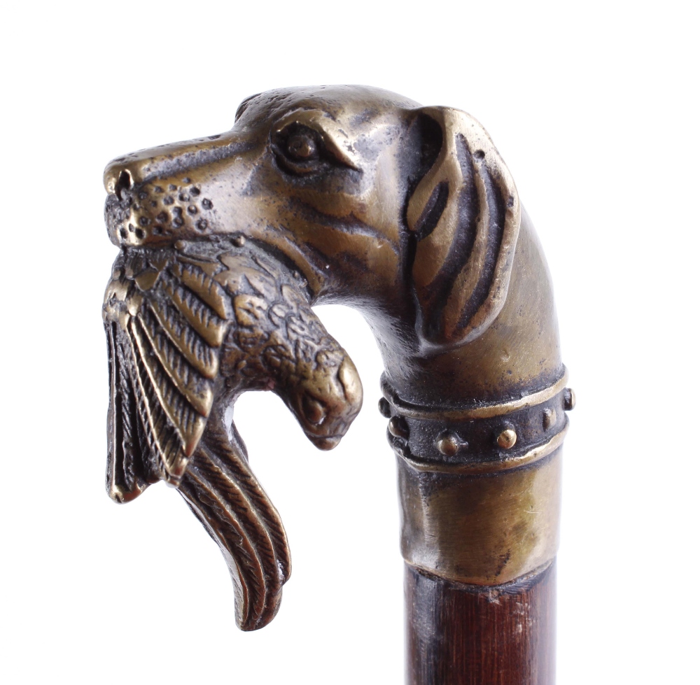 Walking cane with brass game dog and bird handle