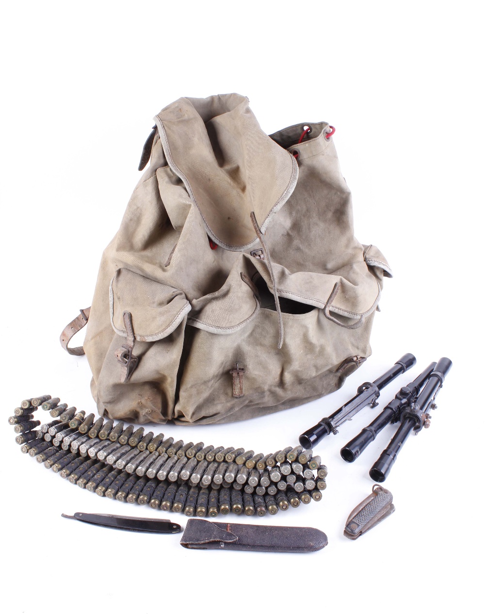 Rigid frame rucksack with quantity of once fired cases, 3 x scopes, pocket tool, and folding razor