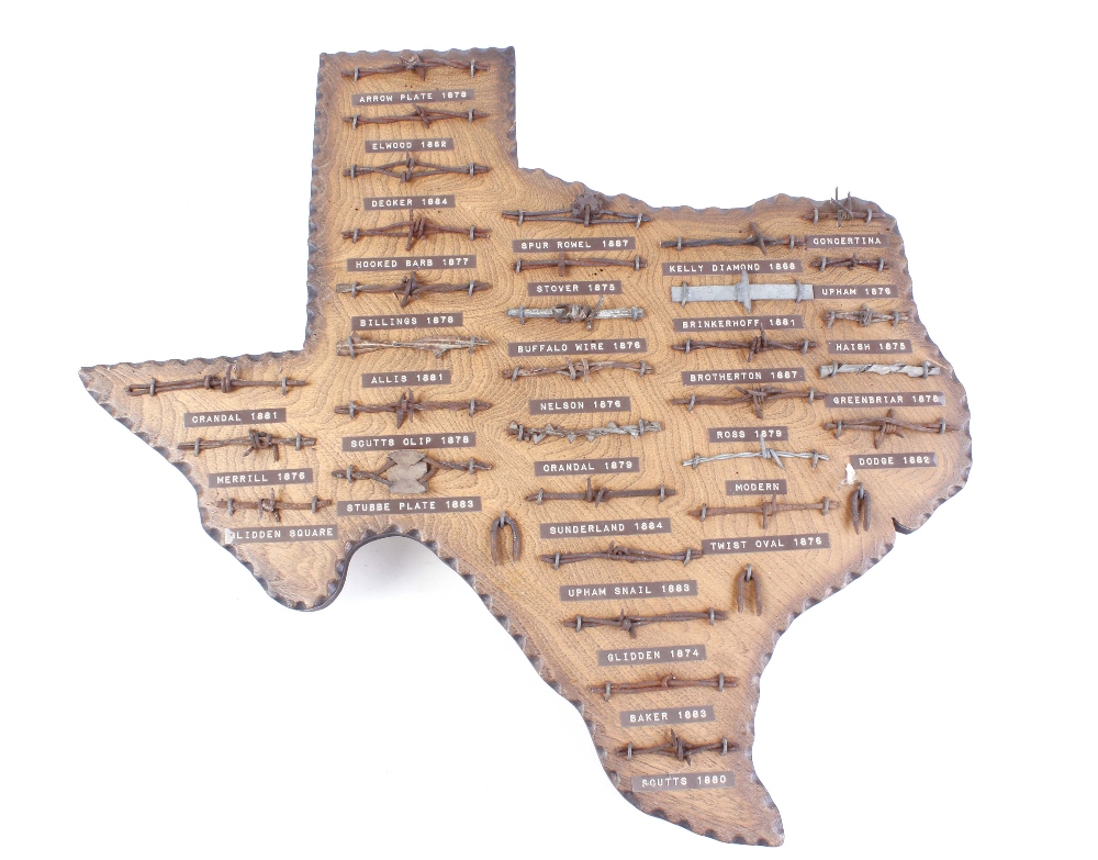32 vintage barbed wire samples from The Old West, mounted on a wood plaque in the shape of the state
