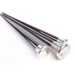 Three tapered ebonised walking canes with silver pommels and metal ferrules