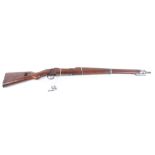 The wood and metal work of a Mauser K98 1915 bolt action military rifle