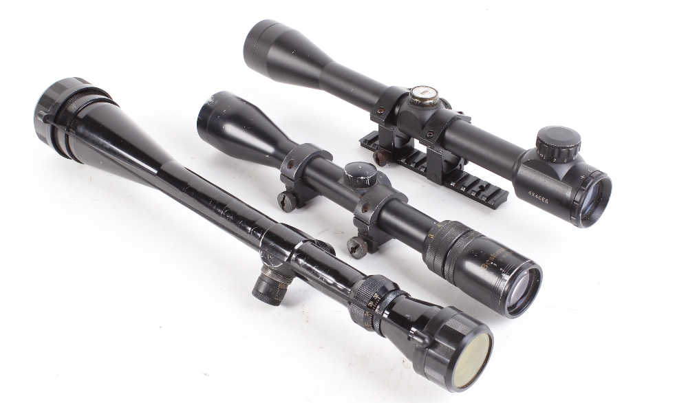 3-9 x 38 Bushmaster scope with mounts, Optima 8-32 x 44 scope, and 4 x 40 EG scope with mounts and r