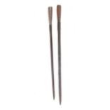 Two reproduction iron spear tips, overall 21½ and 23 ins