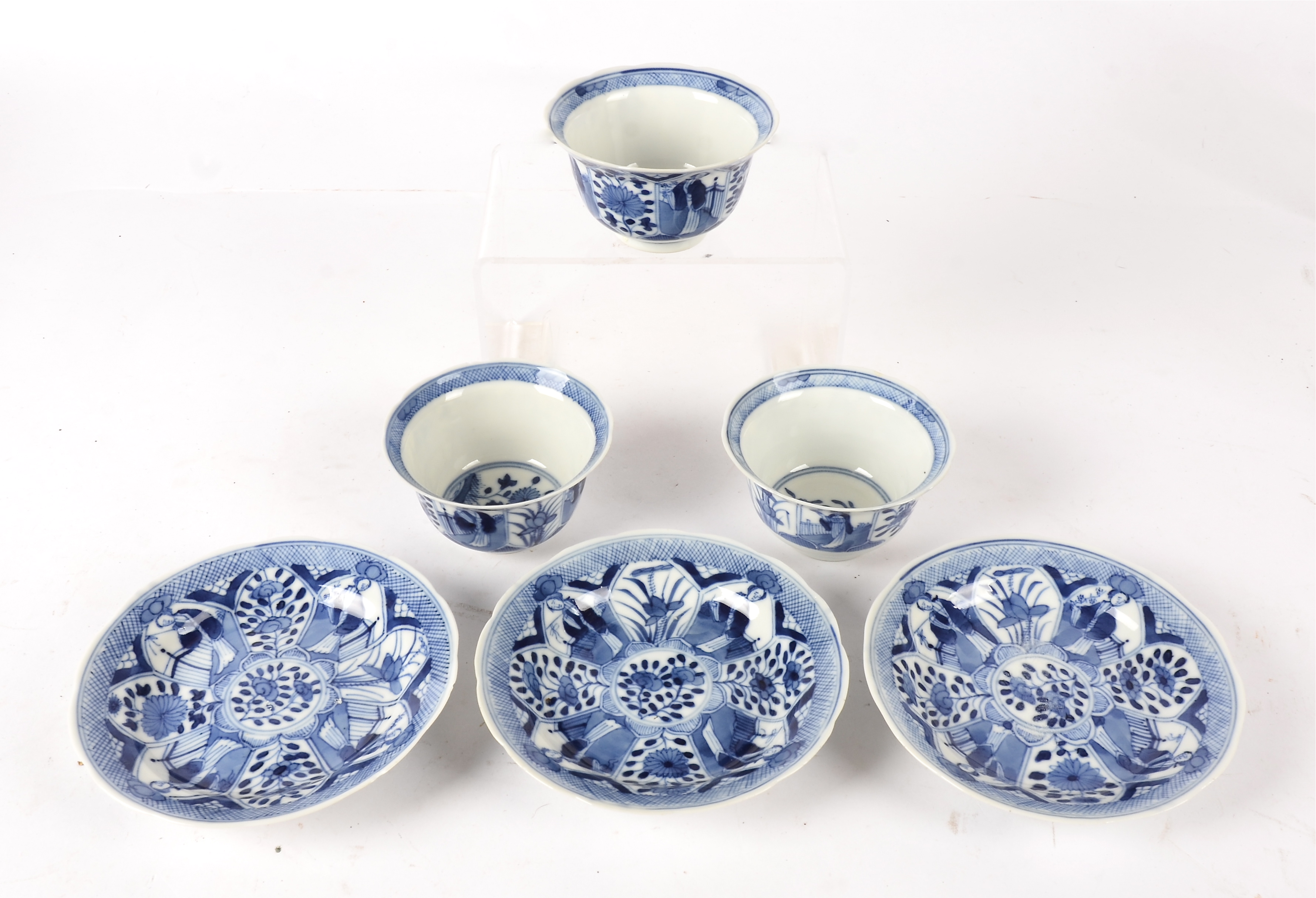 Three blue and white tea bowls and saucers, in the Kraak tradition but later, divided into