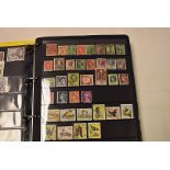 A large collection of stamps and First Day Covers, in two plastic boxes, with a folder of world