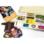 A collection of beer mats and matchbox labels, the beer mats in two show boxes, the matchboxes and