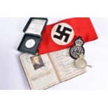 A WWII Third Reich soldier's Defence Pass book, having photograph and personal details of the