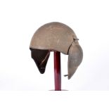 A 1940s period US Airforce M5 Flak helmet, having fold down steel ear protectors, strap liner and