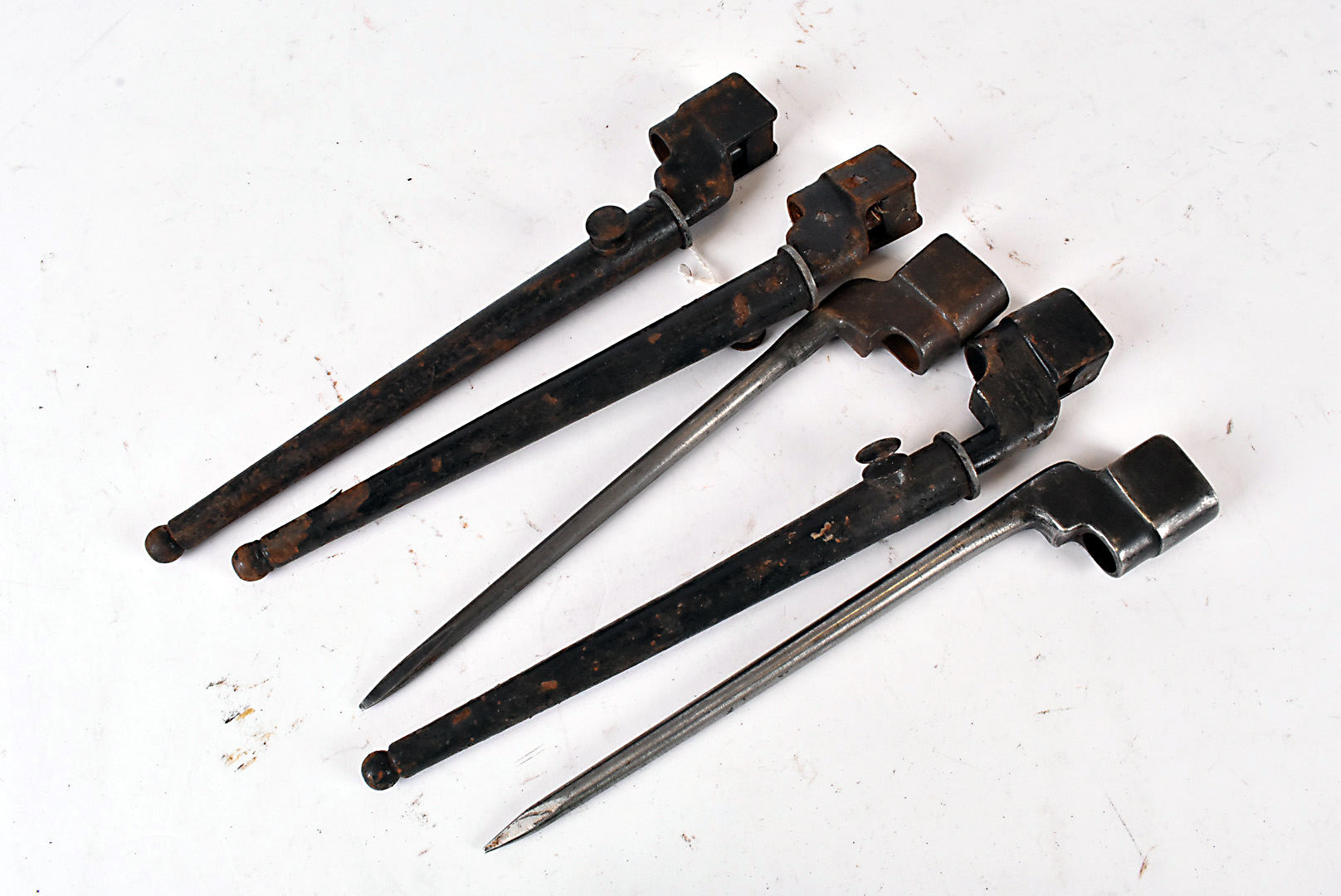 Five British No.4 spike bayonets, three having scabbards, two without (5)