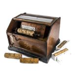 A 20-note organette, Concert Roller Organ, in gilt-stencilled walnut case with internal Boston,