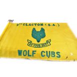 A 9th Clacton (S.A) Wolf Cubs flag, the yellow flag having green writing and central wolf and