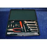 A Jaguar car tool kit, comprising spanners, pliers, screw driver, tyre gauge and spare lights, all
