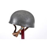 A WWII British Paratrooper helmet, marked BMB and dated 1944 to the leather liner, size 7 3/4,