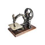 A chainstitch sewing machine, Willcox & Gibbs, with patent dates to 1883 (lacking cotton-reel