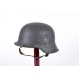 A Reproduction German M35 helmet, single decal, stamped LT68 and 18 to the inner back, complete with