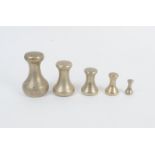 A collection of brass and plated Weights, including bell weights up to 7lbs, nesting weights,