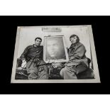 Boxing, a b/w photograph of Muhammad Ali holding a photograph of himself with fan (37cm x 28cm stuck