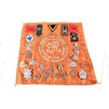 An assortment of metal cap and cloth badges, Royal Artillery Volunteers, RAF, RASC, RAMC, The