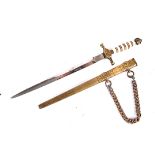 An Imperial German miniature Naval dagger, having moulded brass hilt and cross guard with bone grip,