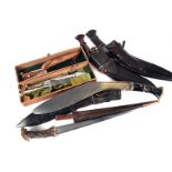 Three Middle Eastern Kukri knives, not complete, together with a boxed Puma White Hunter knife and