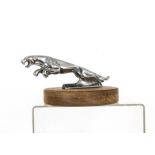 Jaguar MK II Car Mascot, a chromed example in the form of a leaping jaguar, on modern circular