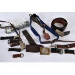 An assortment of German items, to include hangers, belt loops, field dressing, black and white