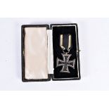 A WWI Iron Cross 2nd Class, marked KAII to the hanger loop, in box (2) please form own opinion