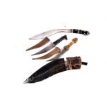 Two horn handled Middle Eastern daggers, both having engraved design to the curved blade, with