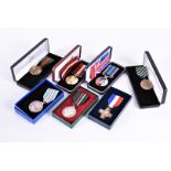 A collection of Commemorative medals awarded to Corporal H.W Shury (23208206) of the Territorial