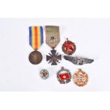 A collection of Overseas Medals and badges, to include French Medaille de la Victoire, French
