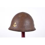 A WWII Japanese Naval Landing Forces Marine helmet, the steel helmet having yellow painted anchor to