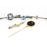 A collection of bar brooches, including a 9ct gold amethyst example, a 9ct gold seed pearl