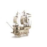 An impressive George V period silver model of a warship by the Fairpoint Brothers, having four masts