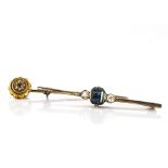 A 15ct gold ruby gypsy set stick pin, together with an Art Deco tourmaline and diamond set bar