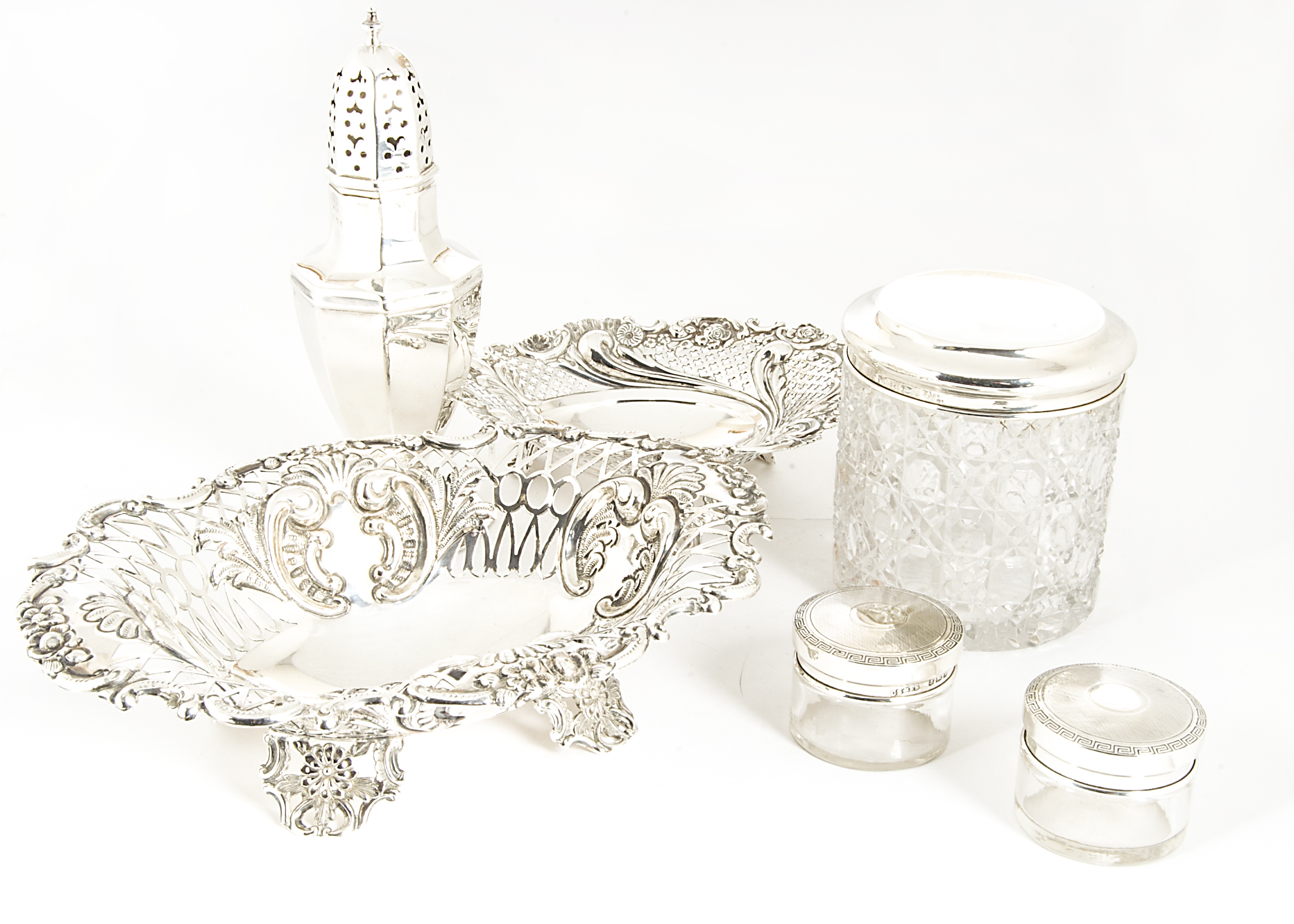 Six Victorian and later silver items, including two pierced bon bon dishes, a sugar caster, a cut