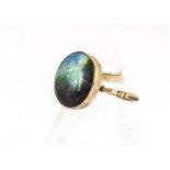 A black opal gold ring, the Georgian style setting with cushion worked back on an ornate yellow