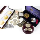 A small collection of British coins and medallions, including a 2010 UK uncirculated collection