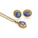 A 9ct gold opal triplet suite, comprising a tear shaped pendant drop and two stud earrings with rope