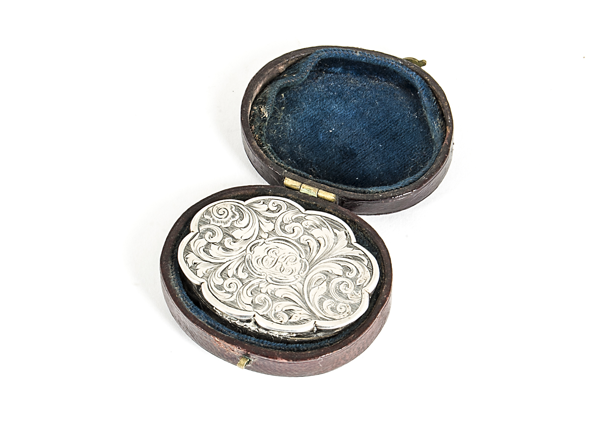 An early Victorian silver vinaigrette by Nathanial Mills, in small leather case, the lobed form with