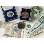 A collection of 20th Century British coins and bank notes and more in a Crawford's biscuit tin