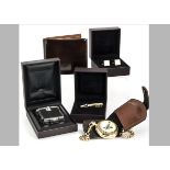 Four boxed modern Dunhill items, including a Photo Frame Quartz watch, a leather wallet, a pair of
