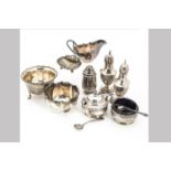 A group of Edwardian and later silver cruet items, including a pair of Georgian style peppers, a