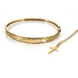 A 9ct gold bangle, with engraved leaf decoration together with a 9ct gold cross pendant and gold