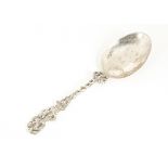 An antique continental silver spoon, having figural and pierced handle, three strike marks to